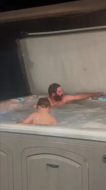 Video thumbnail for Dog Longingly Watching Family Relax in the Hot Tub