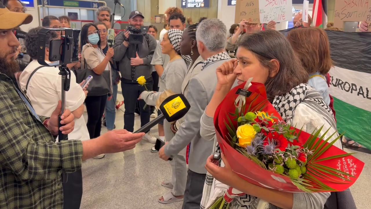 Video thumbnail for France: Supporters welcome freed Gaza flotilla activists at Paris airport following release.