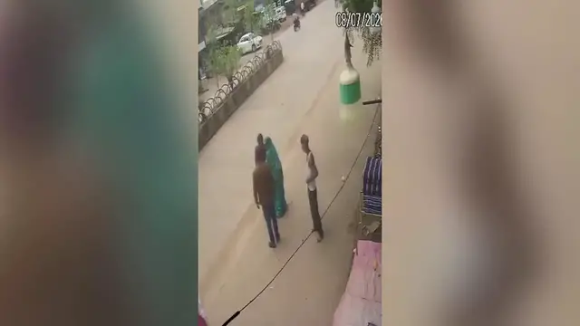 Video thumbnail for India: School van rear gate left unlocked as child falls onto busy road during drop-off.