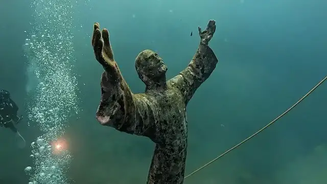 'Video thumbnail for Underwater Christ statue in Liguria cleaned by divers'