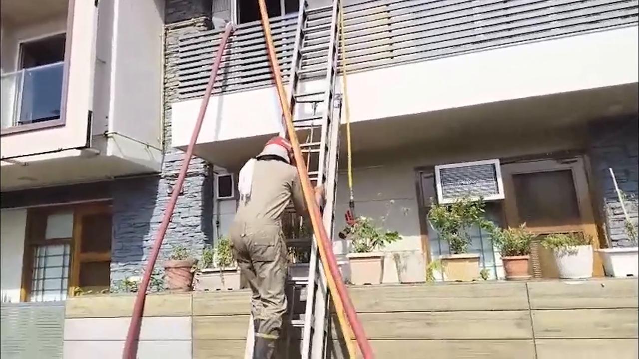 Video thumbnail for India: 9 killed in house fire after air-conditioner blast in Delhi.