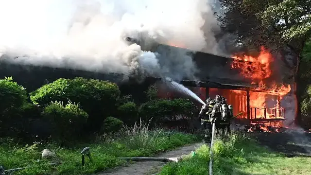 Video thumbnail for Firefighter and homeowner injured during Smithtown house fire