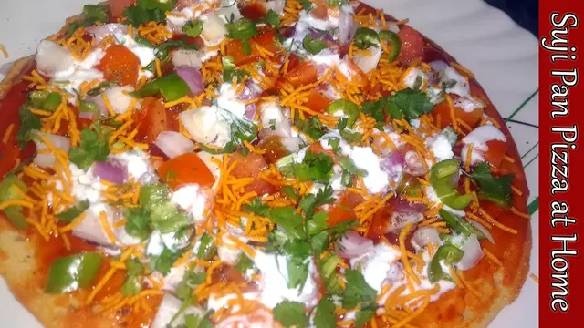 Video thumbnail for लॉकडाउन में घर में सूजी से तवे पर बनाये पिज़्ज़ा / How to Make Pizza In Lockdown / Suji Pan Pizza