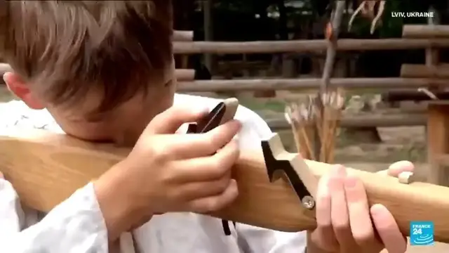 Video thumbnail for Ukrainian children learn ancient warrior skills amid modern war