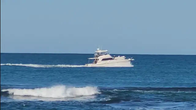 'Video thumbnail for A boat cruising past Hillarys Boat Harbour'