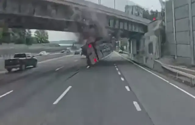 Video thumbnail for Dashcam video captures tractor-trailer striking overpass and overturning on Thruway in Nyack