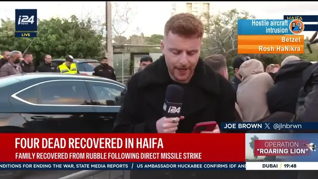 Video thumbnail for Family recovered from rubble following direct missile strike