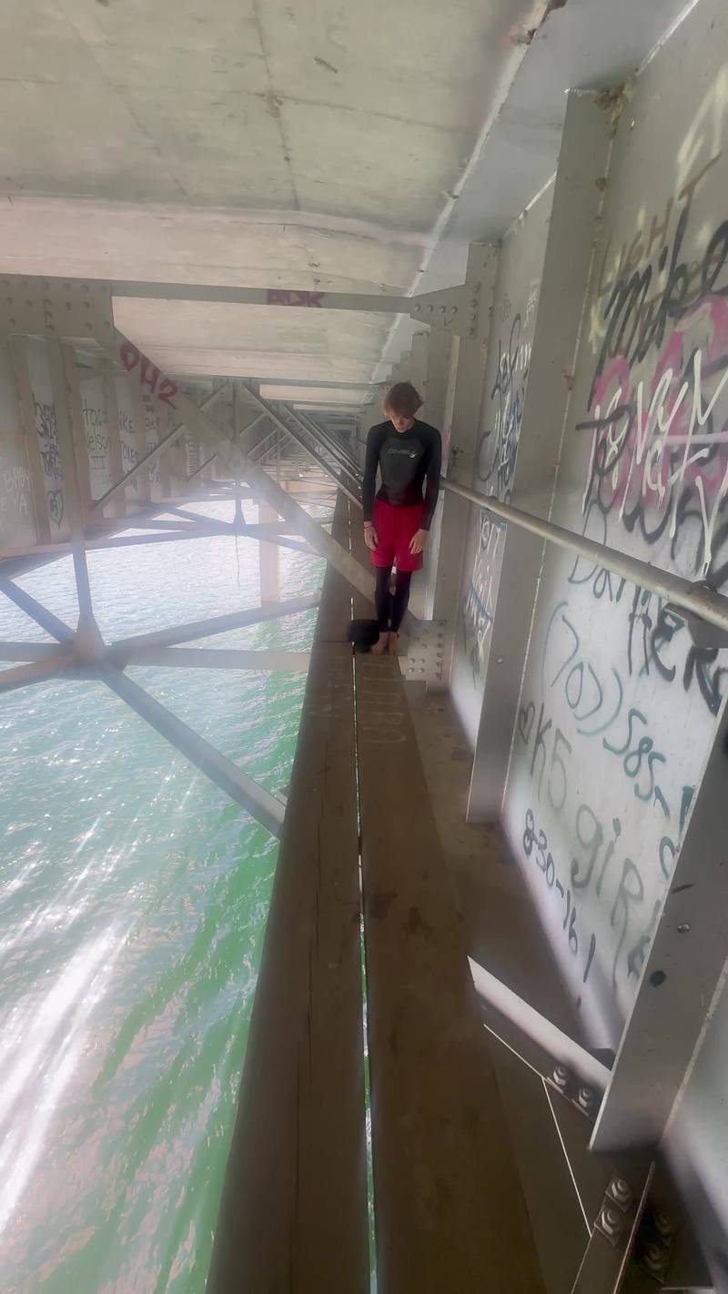 Video thumbnail for Daring Backflip from a Graffiti Covered Bridge Catwalk
