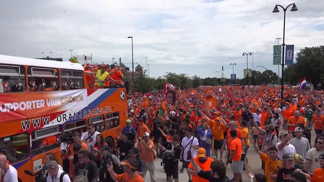 Video thumbnail for US: Dutch fans march to AT&T Stadium ahead of World Cup clash with Japan.