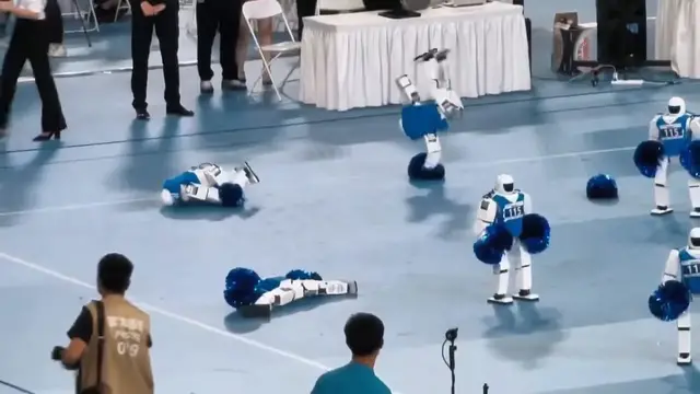 Video thumbnail for China: Cheerleading robot collapses and twitches like street dancer at games in China.