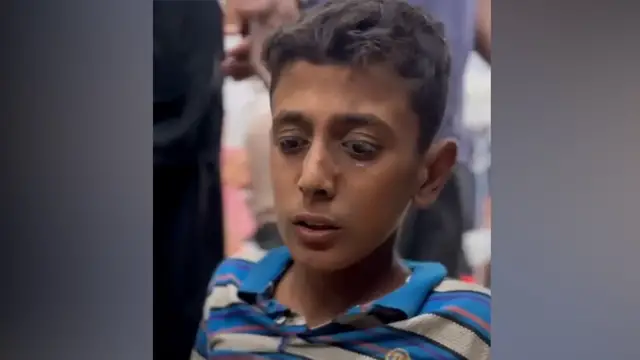 'Video thumbnail for Palestinian boy in Gaza shot in leg while retrieving food aid'