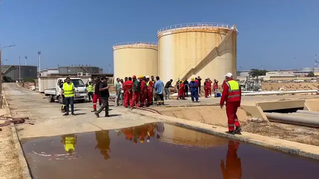 Video thumbnail for Libya: Firefighters battle blaze after drone attack at Libya's Zawiya oil refinery.