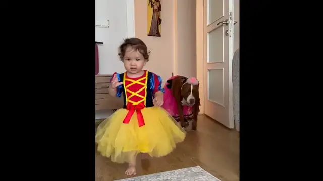 Video thumbnail for Daughter and Dog Stroll in Playful Outfits
