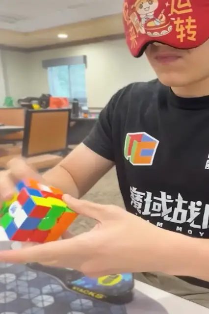 Video thumbnail for Fastest time to solve a 3x3x3 rotating puzzle cube blindfolded - 11.56 seconds by Tommy Cherry