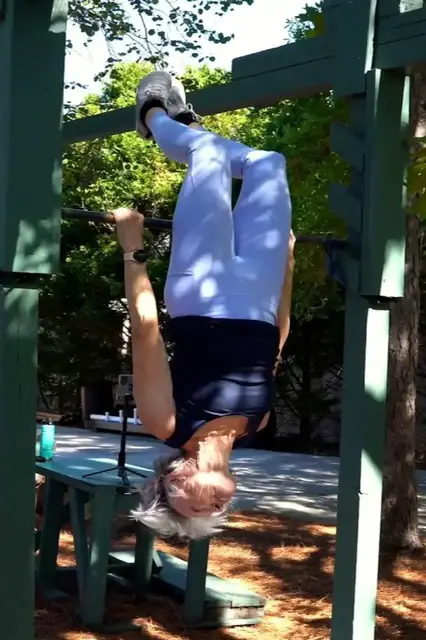 Video thumbnail for Oldest person to perform an inverted bar hang (female) - Ginny MacColl at 74 years and 196 days old