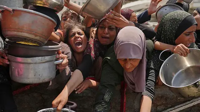 'Video thumbnail for People in Gaza scramble for food aid as the death toll from hunger rises'