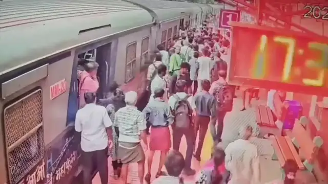 Video thumbnail for India: Passenger Rescued After Falling Between Moving Train and Platform in Chennai.