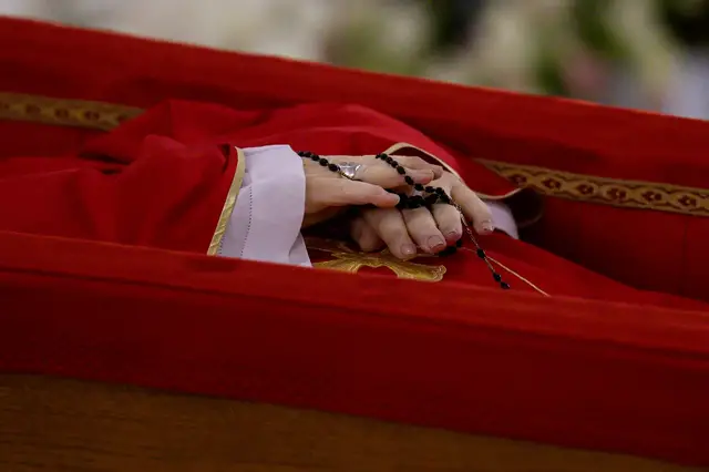 Video thumbnail for Vatican video shows Pope in open casket