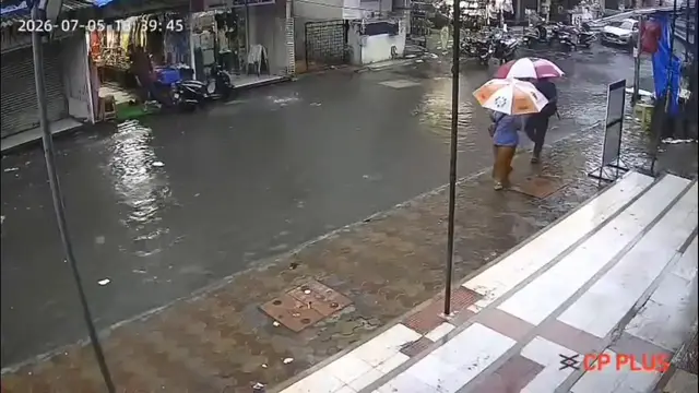 Video thumbnail for India: Miraculous Escape: Woman Survives After Flying Tin Sheet Crashes Onto Her During Storm in Maharashtra.