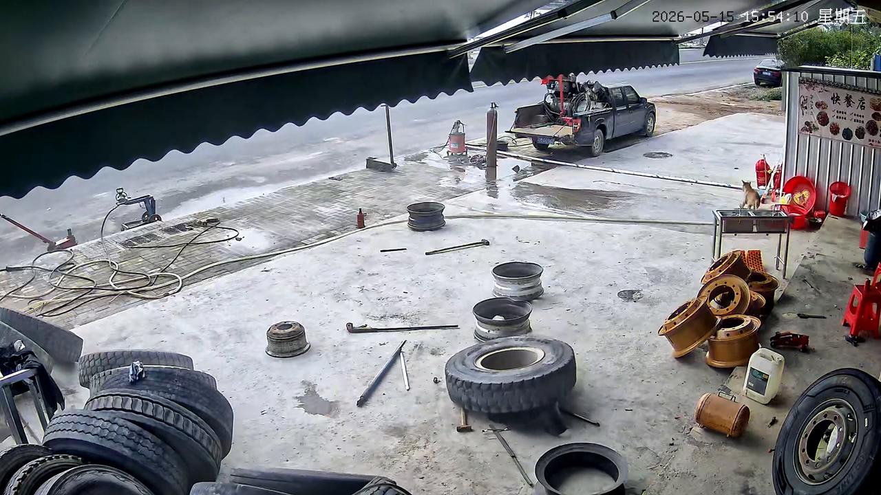 Video thumbnail for China: Chinese man escapes just before repaired tire explodes and shoots upward.