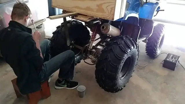 Video thumbnail for Finally putting the bigger tires on the ATV, they are freaking huge compared to the size of the ATV.