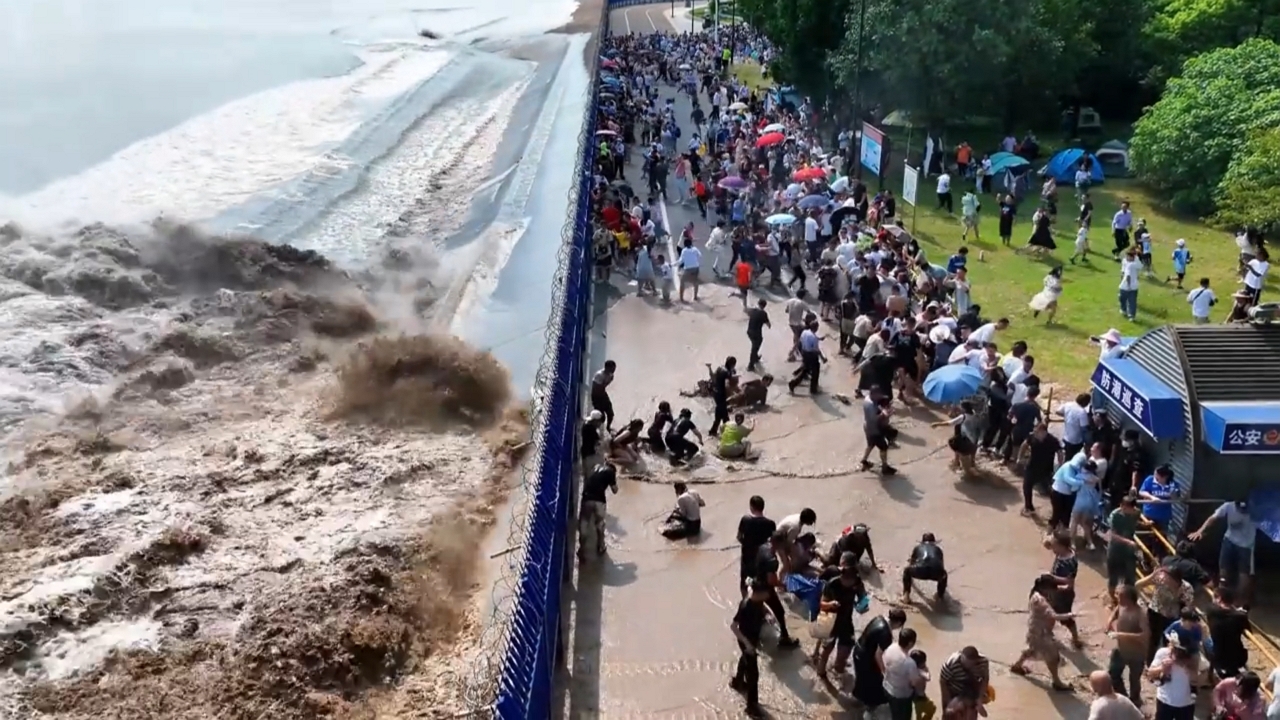 Video thumbnail for Massive Qiantang River Tidal Bore Crashes Over Barrier