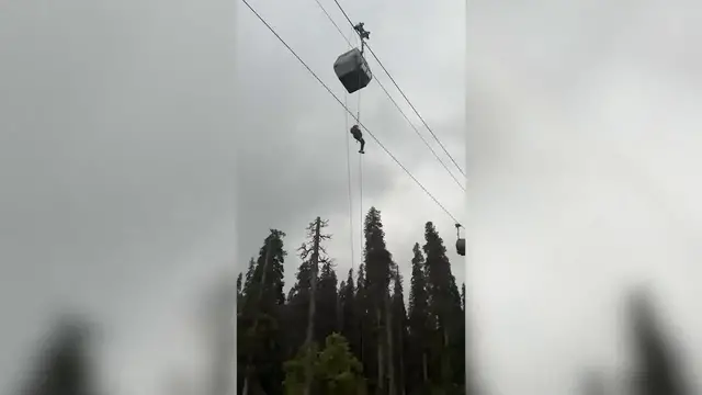 Video thumbnail for Sudden cable car suspension leaves tourists stranded mid-air as officials launch massive rescue mission.