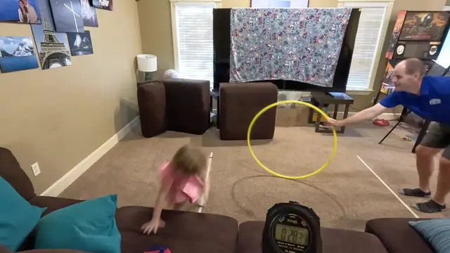 Video thumbnail for Most times to throw and go through a backspinning hula hoop in 30 seconds (team of two)