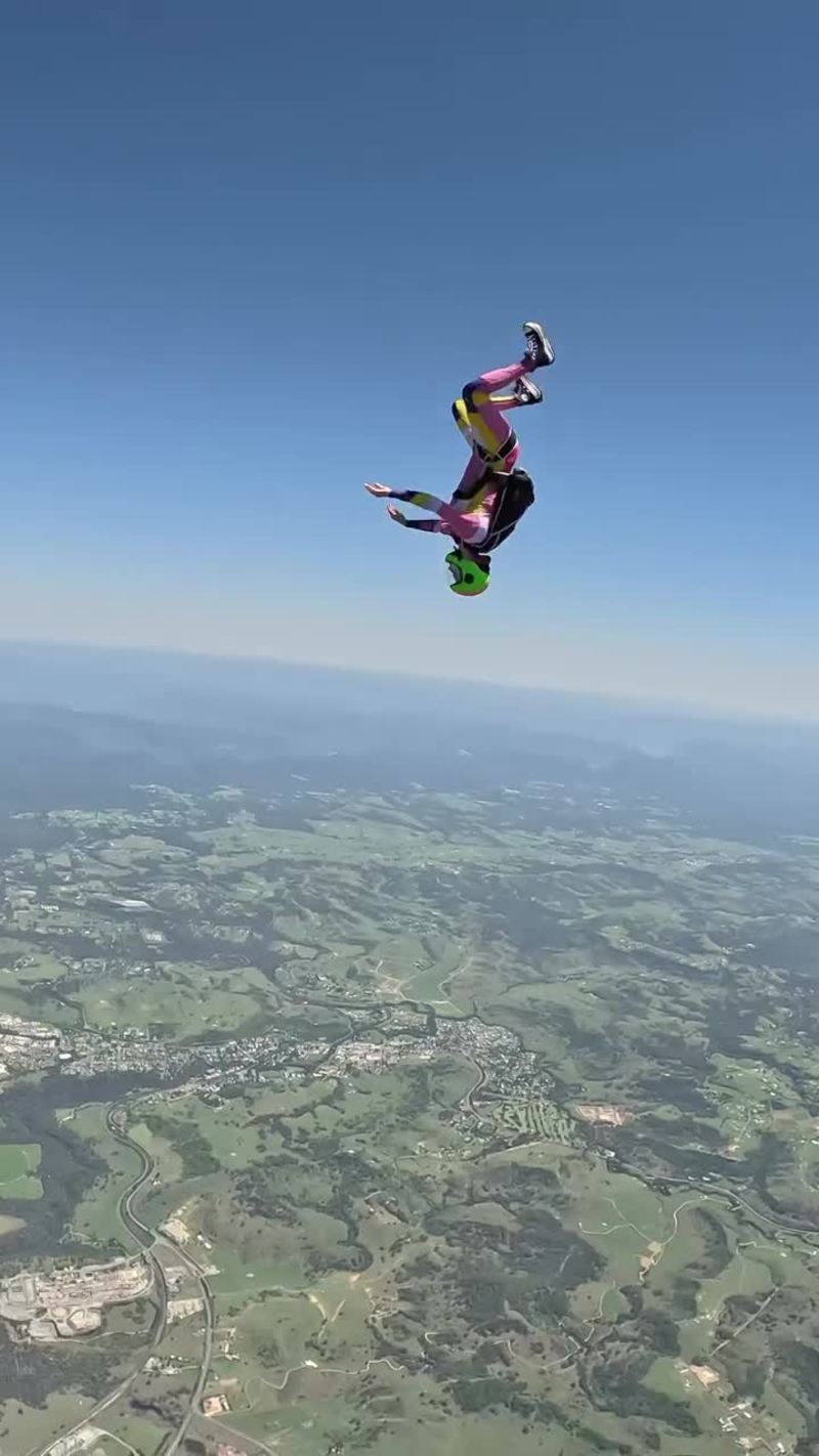 Video thumbnail for Head Down Skydivers Carving through Clear Blue Skies