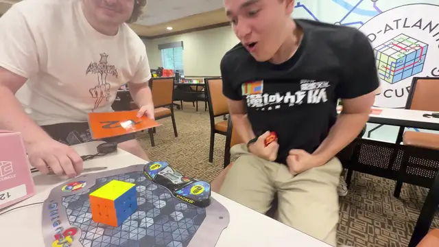 Video thumbnail for Fastest time to solve a 3x3x3 rotating puzzle cube blindfolded