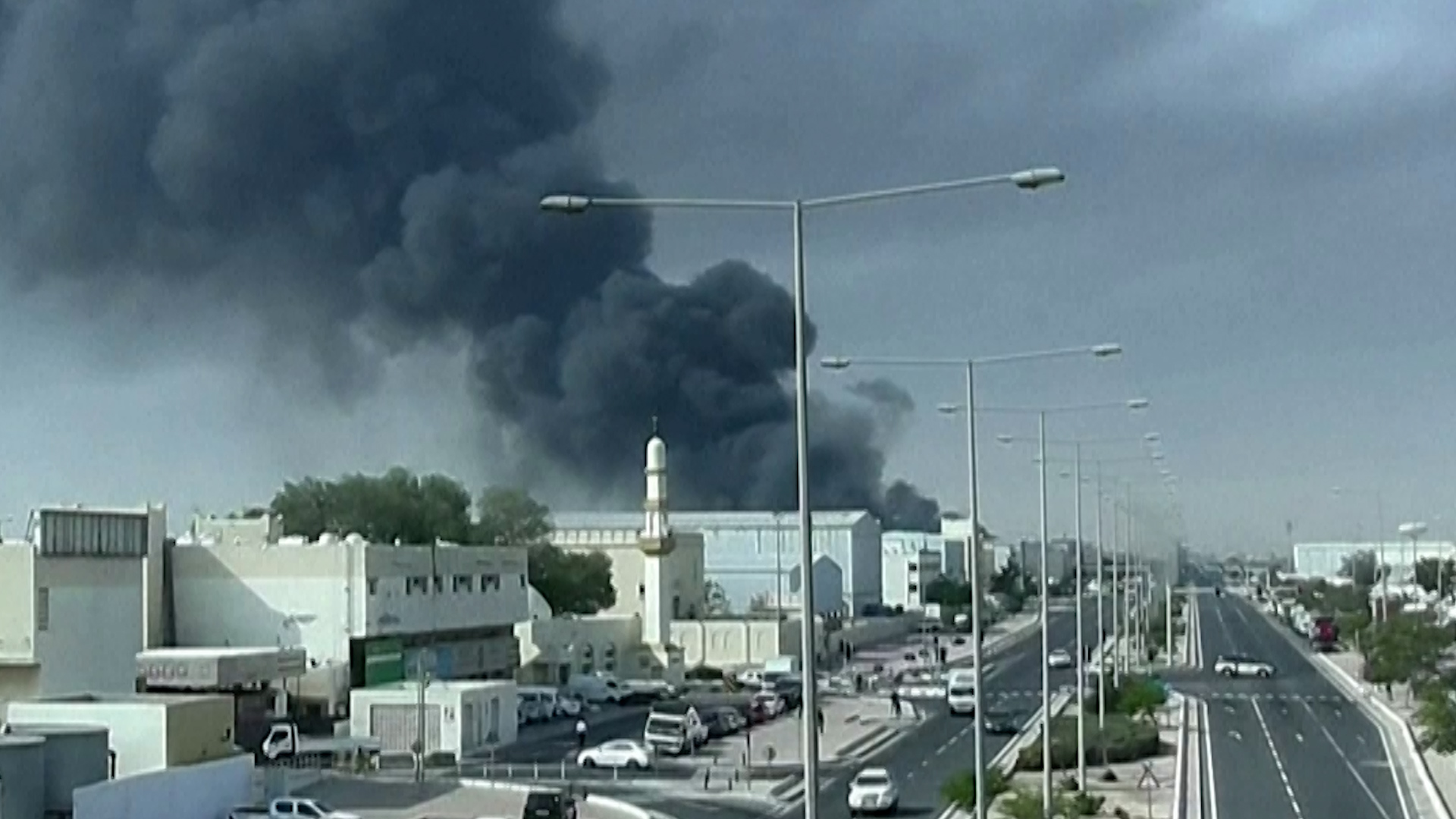 Video thumbnail for Smoke rises above Qatar capital Doha after Iranian missiles shot down