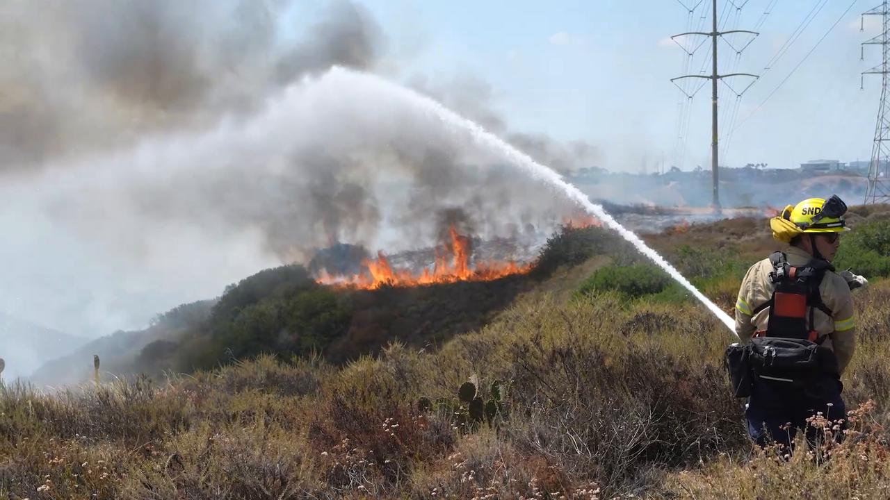 Video thumbnail for US: Brush fire spreads across 80 acres in Sorrento Valley, California.