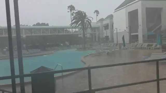 Video thumbnail for US: Storm Winds Hurl Pool Chairs Into Water at Orlando Hotel.