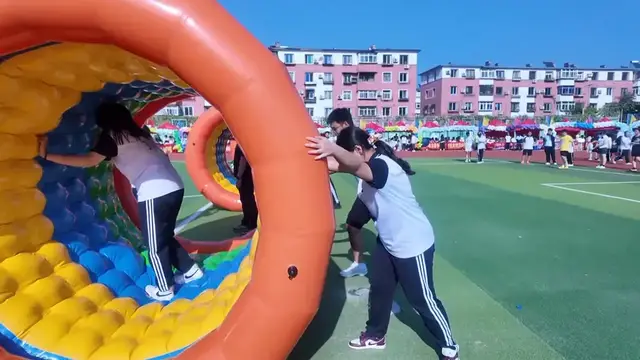 Video thumbnail for Student Spins Out in Inflatable Hamster Wheel at School Fair