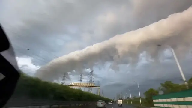 Video thumbnail for China: Massive arc shaped clouds appear over Guangdong before typhoon arrives.