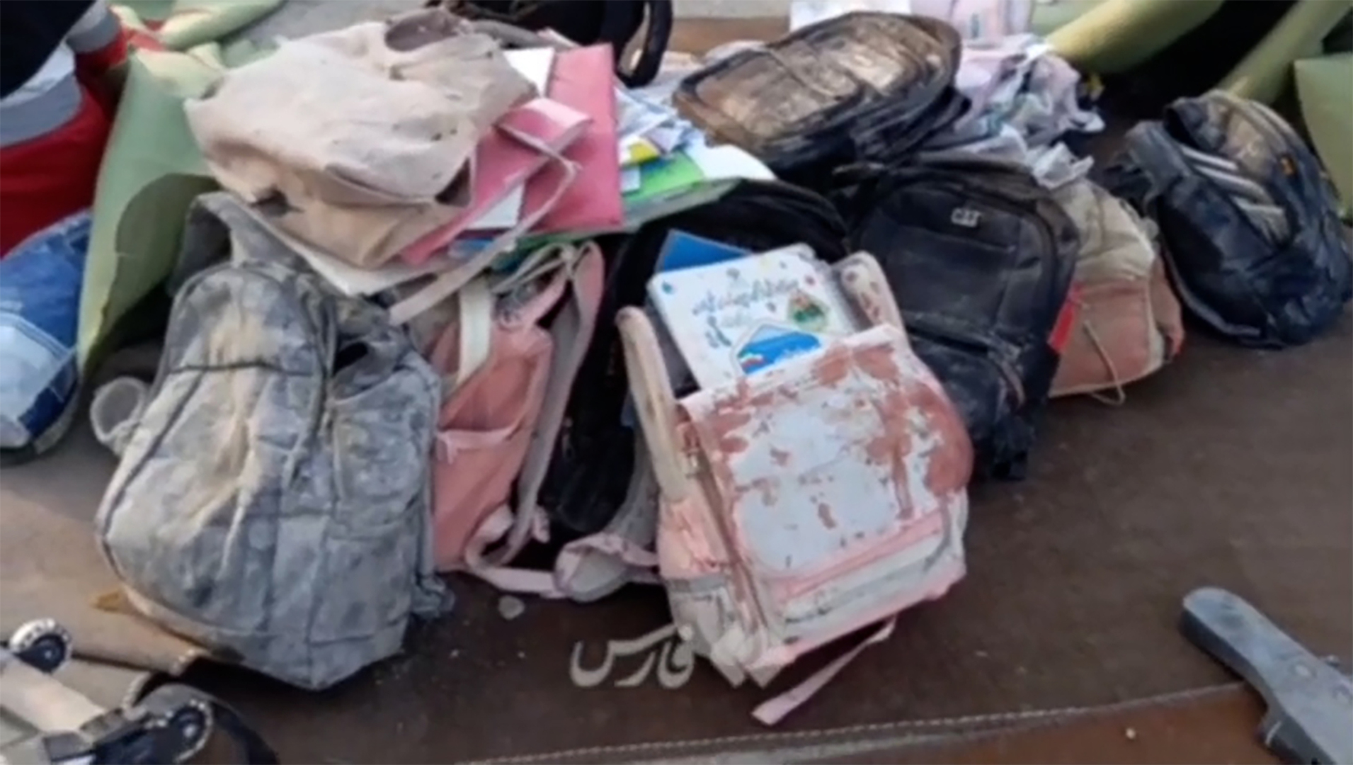 Video thumbnail for Backpacks, schoolbooks seen amid rubble of Iranian girls’ school