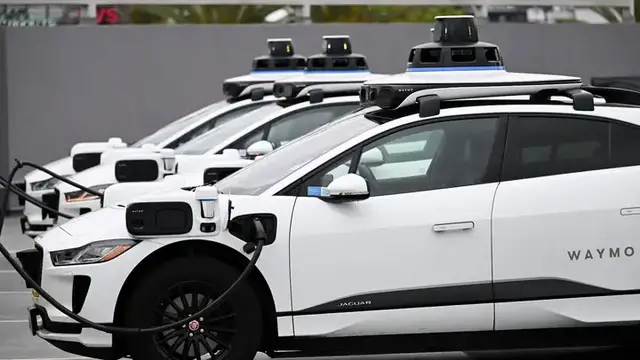 Video thumbnail for Waymo and Uber Hit Breaks on Robotaxis in Arizona