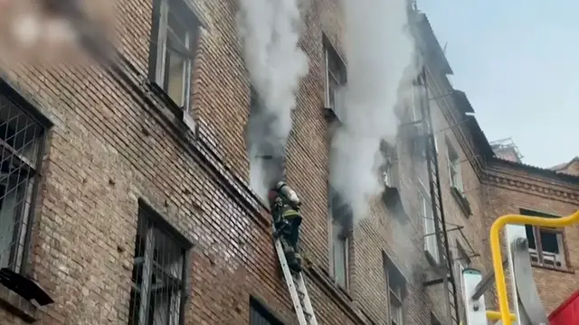 'Video thumbnail for Firefighters extinguish blaze after Russian attack on Kyiv'