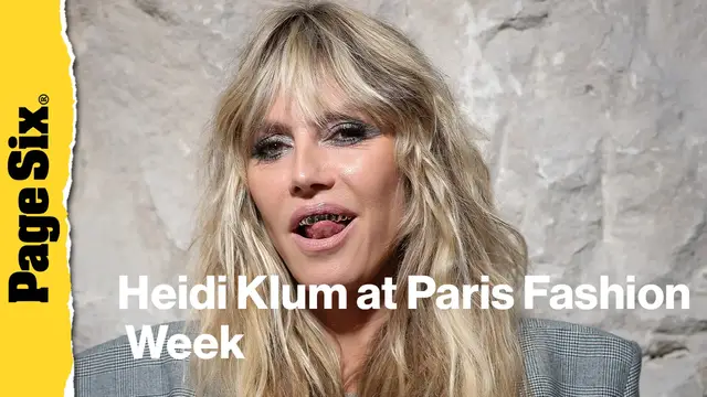 'Video thumbnail for Heidi Klum pairs completely see-through lace dress with a platinum grill at Vetements show during Paris Fashion Week'