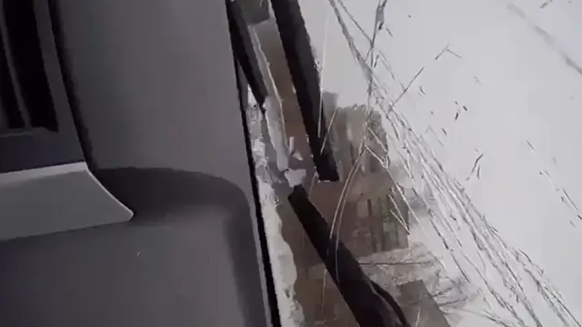 Video thumbnail for Giant Icicle Shatters Windshield, Misses Driver by Inches!