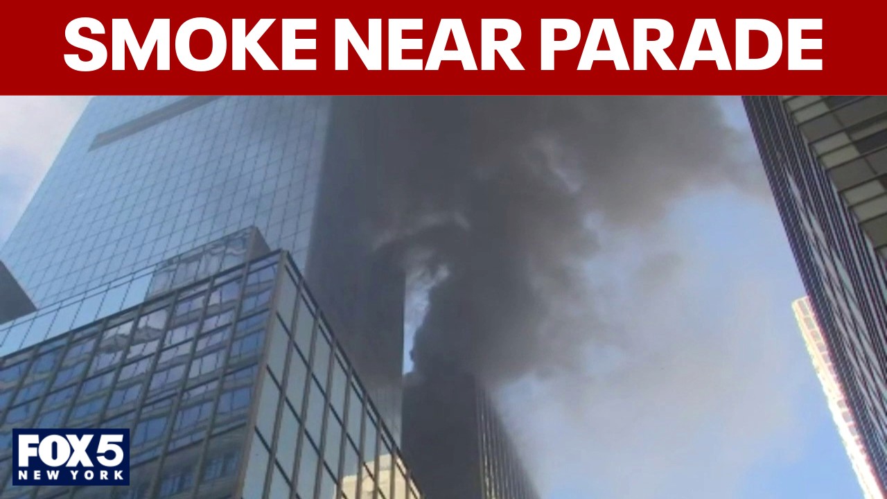 Video thumbnail for Scene near St. Patrick’s Day Parade route as smoke billows from high rise building