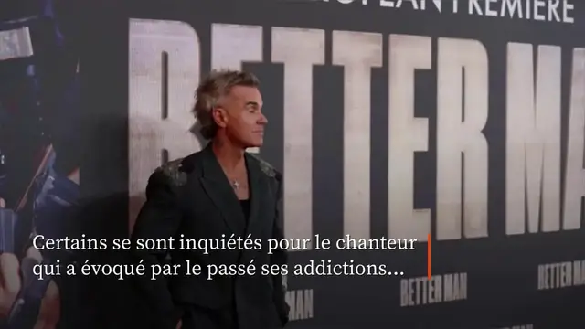 Video thumbnail for Robbie Williams révèle ce qu'était ce petit flocon tombé sur son micro.