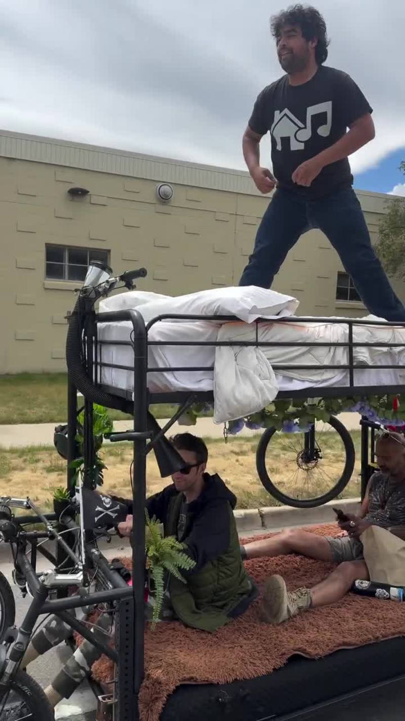 Video thumbnail for Friends Riding a Moving Bunk Bed Bicycle down the Street