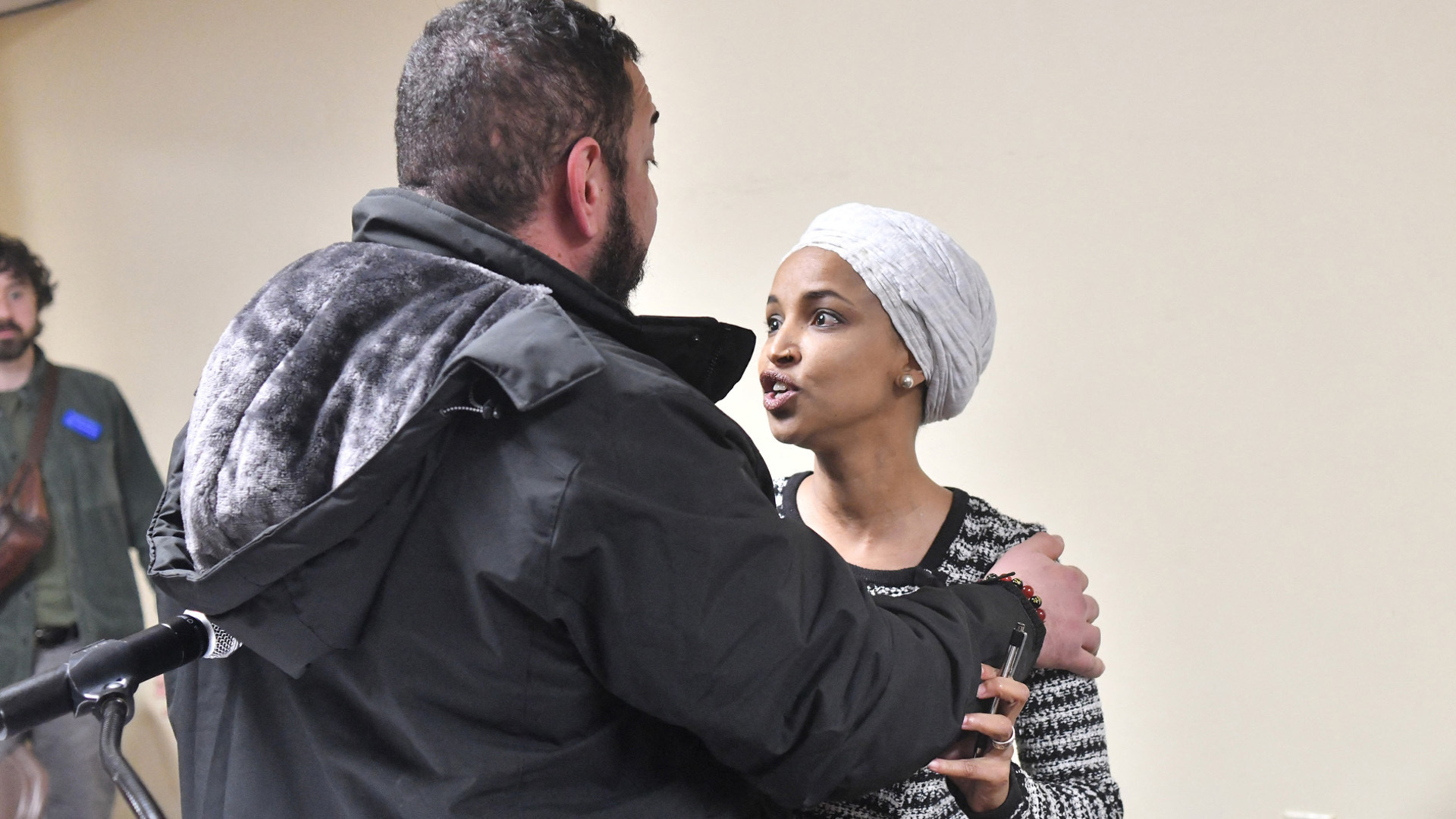 Video thumbnail for US congresswoman Ilhan Omar sprayed with liquid at town hall meeting