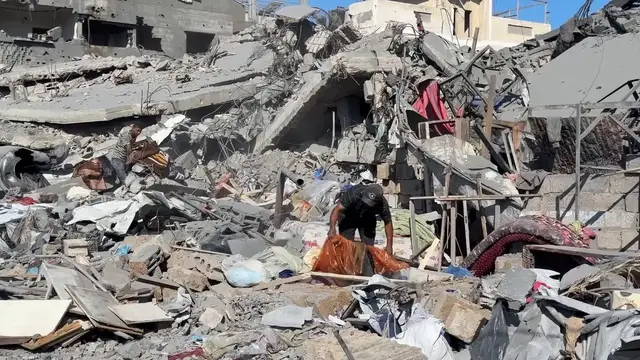 Video thumbnail for Gaza families flee after strike hits Deir al-Balah neighborhood.