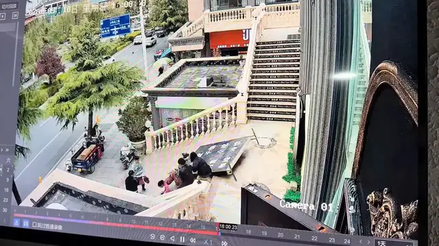 Video thumbnail for China: Chinese woman crushed by falling advertising sign while walking down stairs.