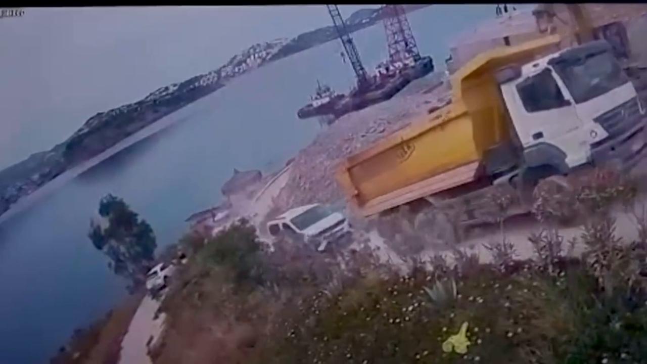 Video thumbnail for Türkiye: CCTV captures dump truck plunging into sea in Türkiye’s Bodrum.