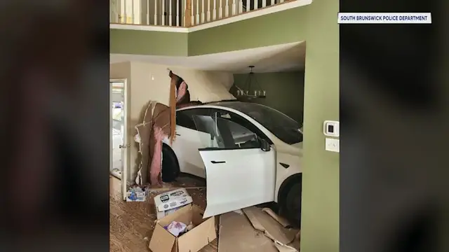 Video thumbnail for Crash lands Tesla in kitchen of South Brunswick home