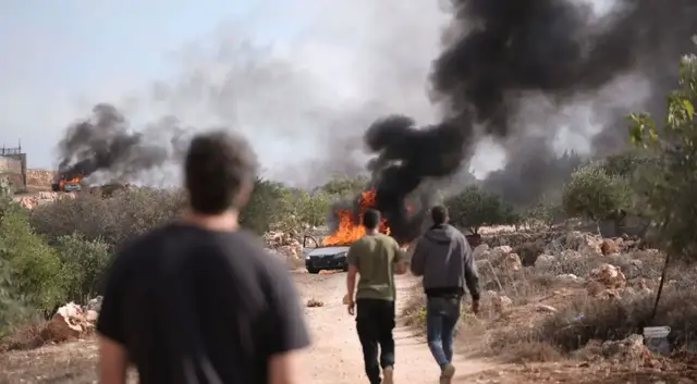 'Video thumbnail for Israeli settlers burn trees, assault Palestinians in occupied West Bank olive harvest attacks'