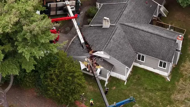Video thumbnail for US: Large crane topples onto homes in New Jersey.